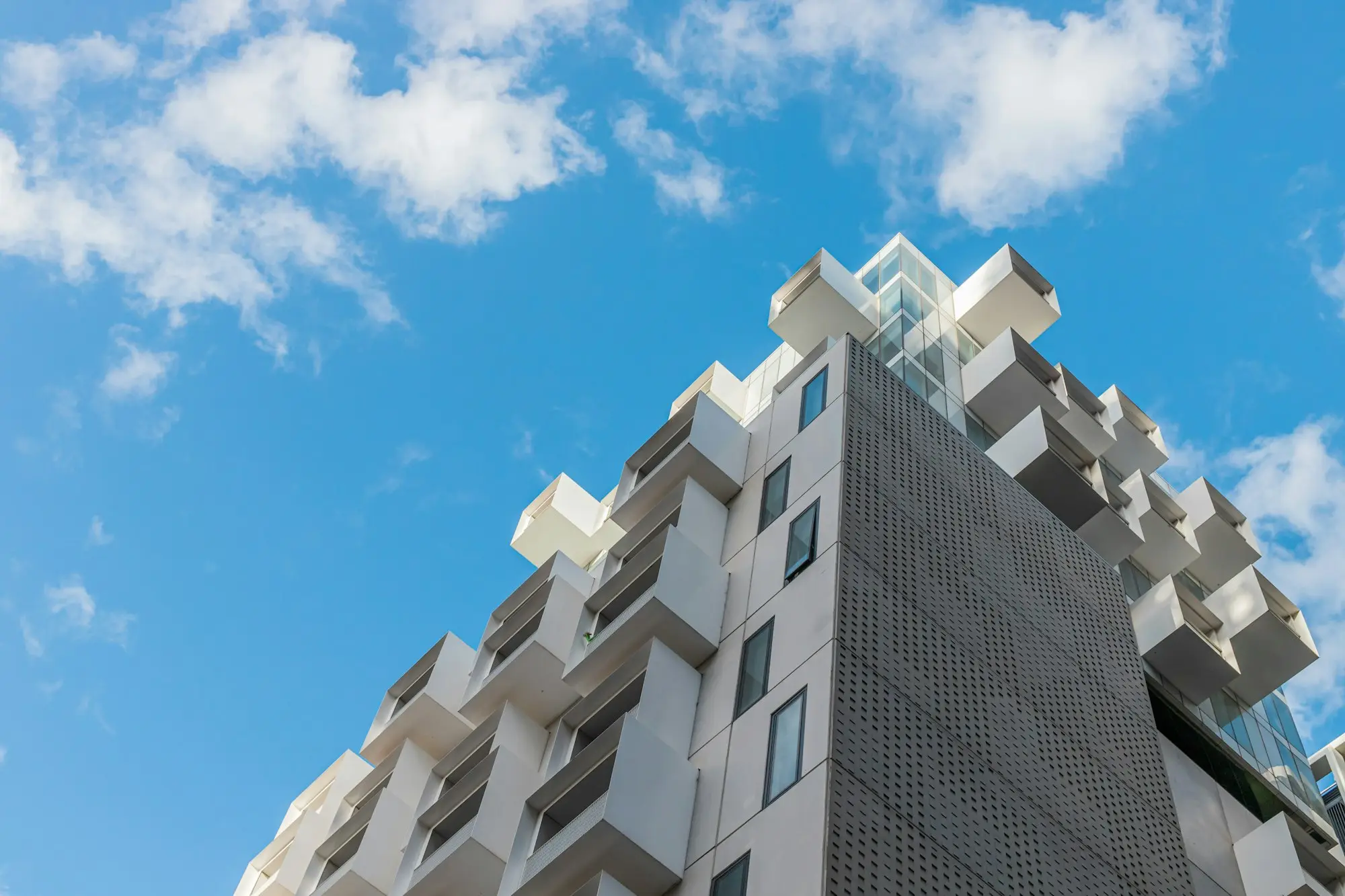 Strata apartment building against a blue sky in Melbourne